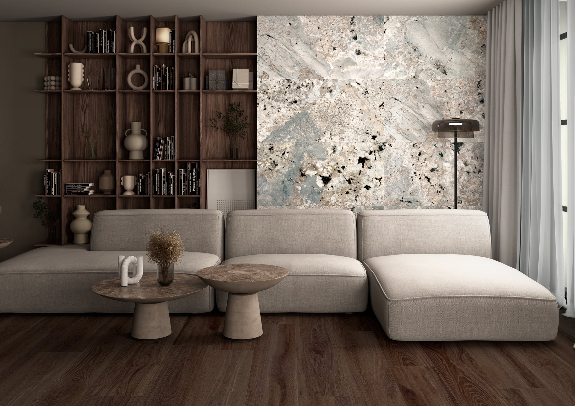 Modern living room with a gray sectional sofa, wooden shelves, and abstract wall art.
