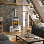 Modern living room with a stone wall, wood stove, and gray sofa.